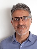 A person smiling for the camera

Description automatically generated